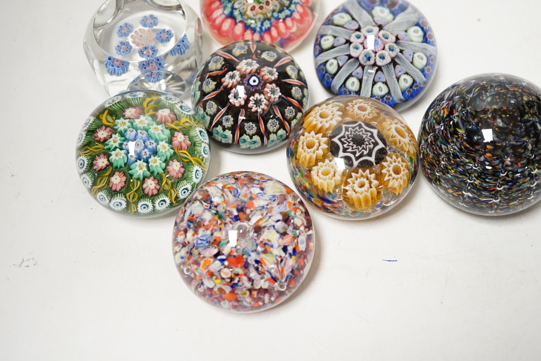 Eight millefiori or scrambled glass paperweights including Strathearn, largest 6cm in diameter